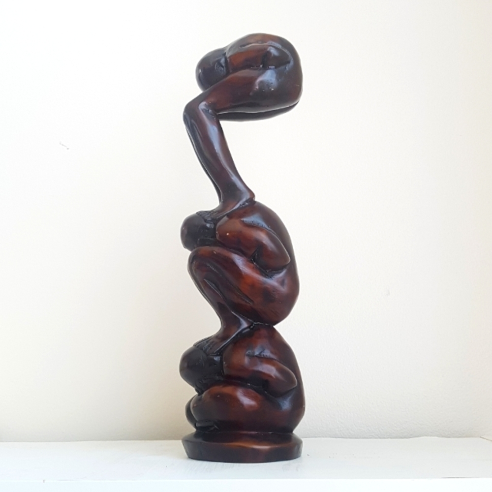 Three Crouching Men Sculpture